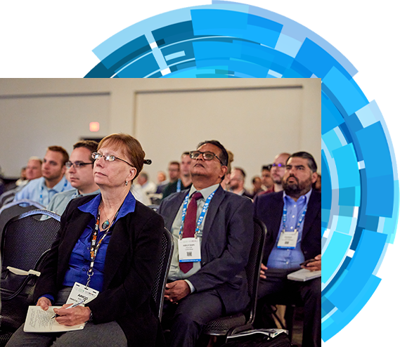 Attendees listening to conference